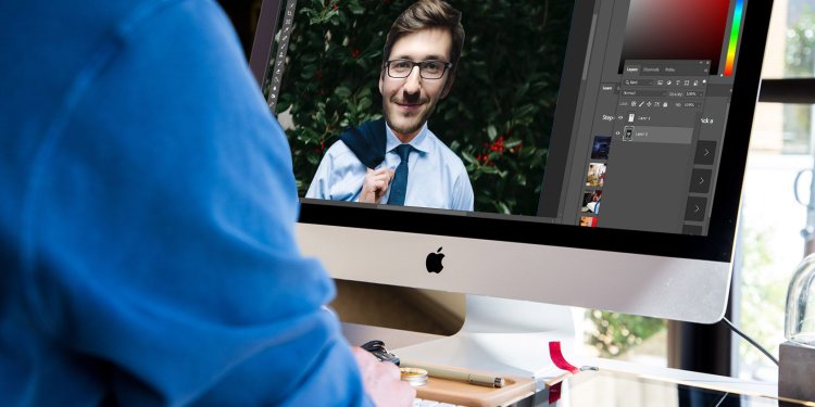 person editing image in photoshop