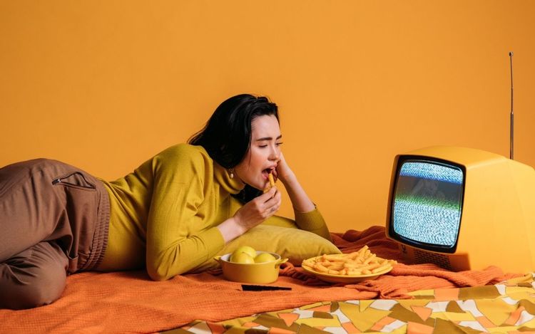 woman watching old TV