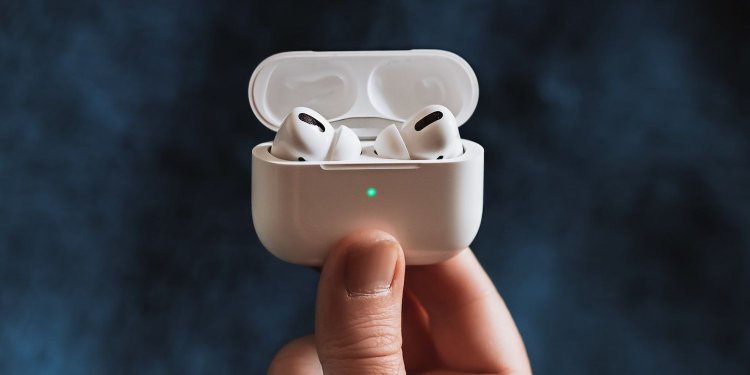 Person holding AirPods Pro featured