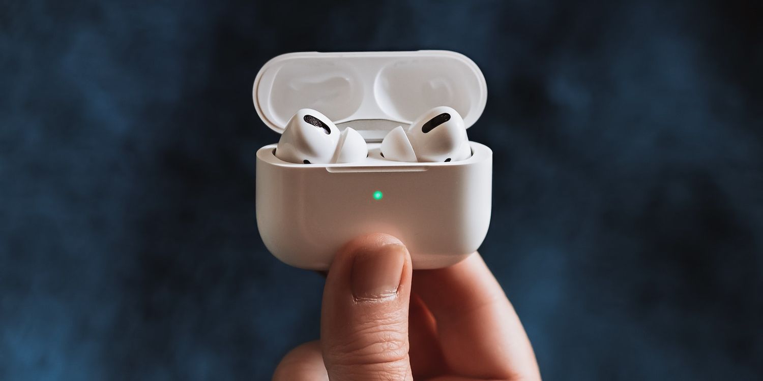 Person holding AirPods Pro featured
